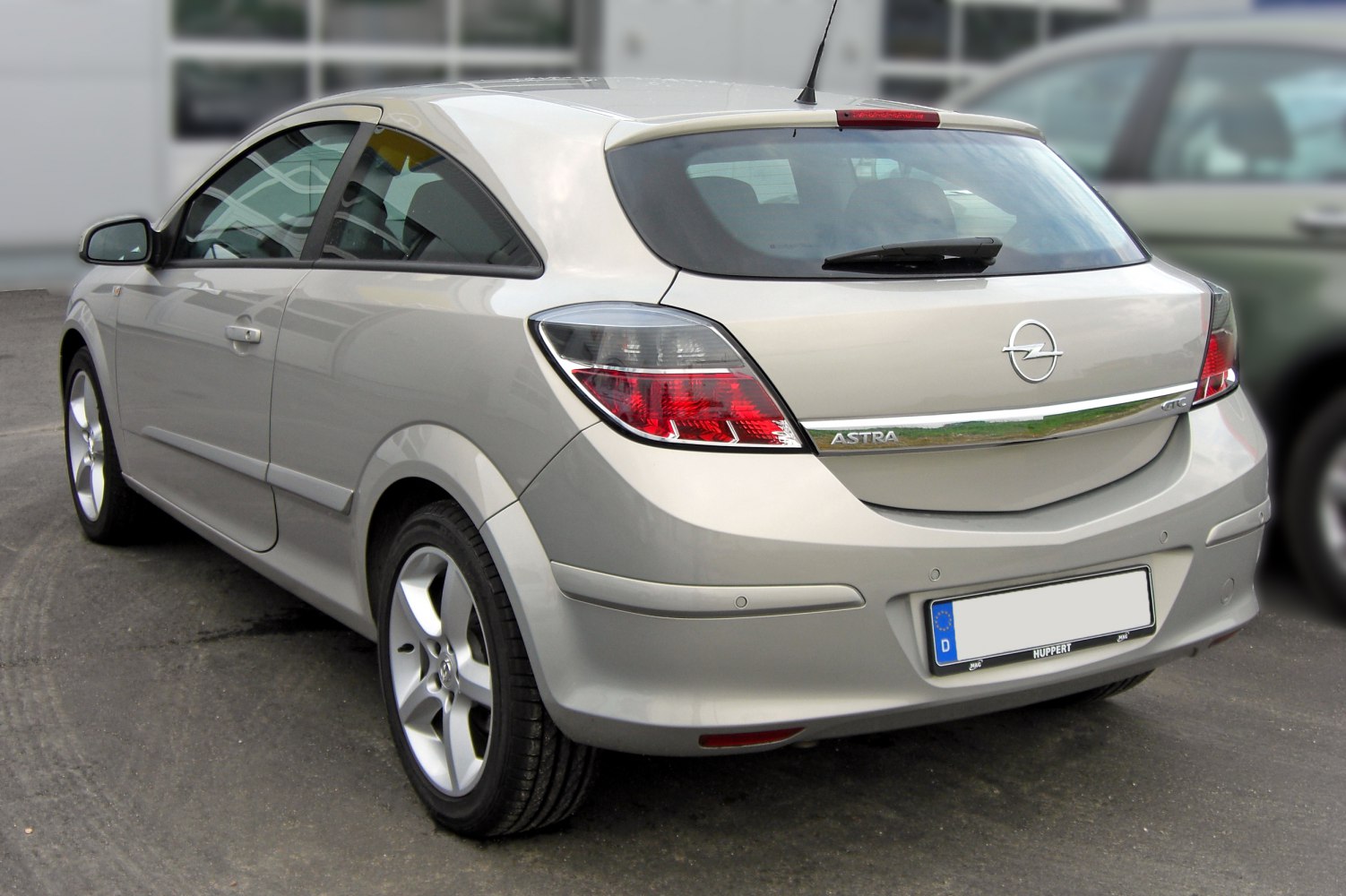 Rear view featuring hatchback, tail lights, and rear windshield wiper.