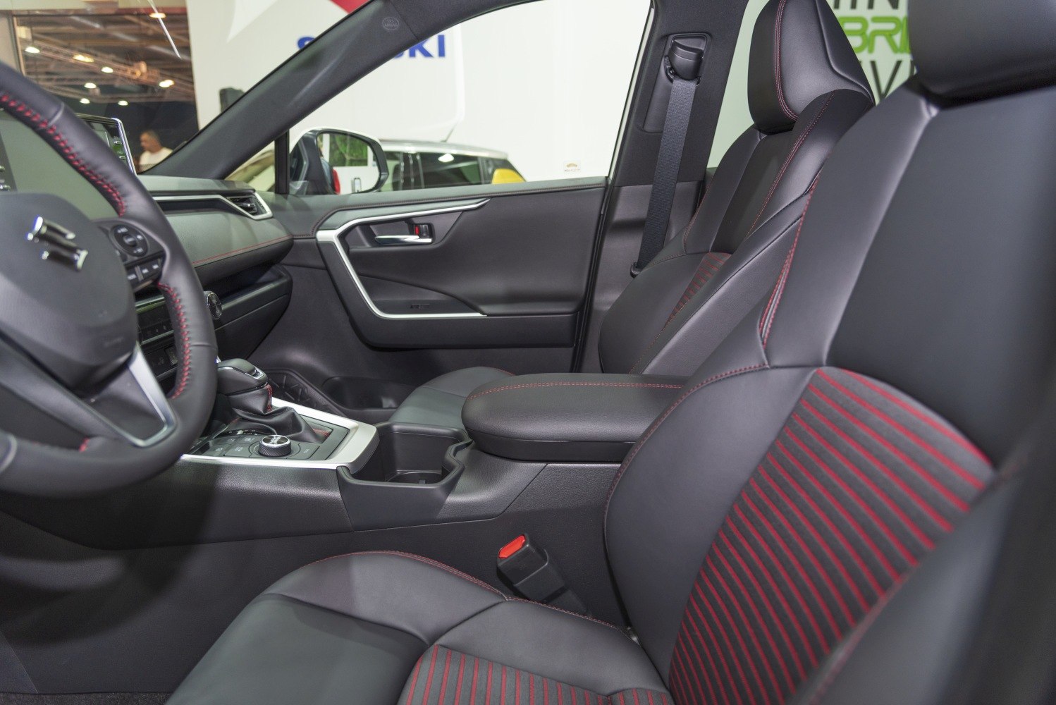 Black seats with red stripes and stitching, detailed center console