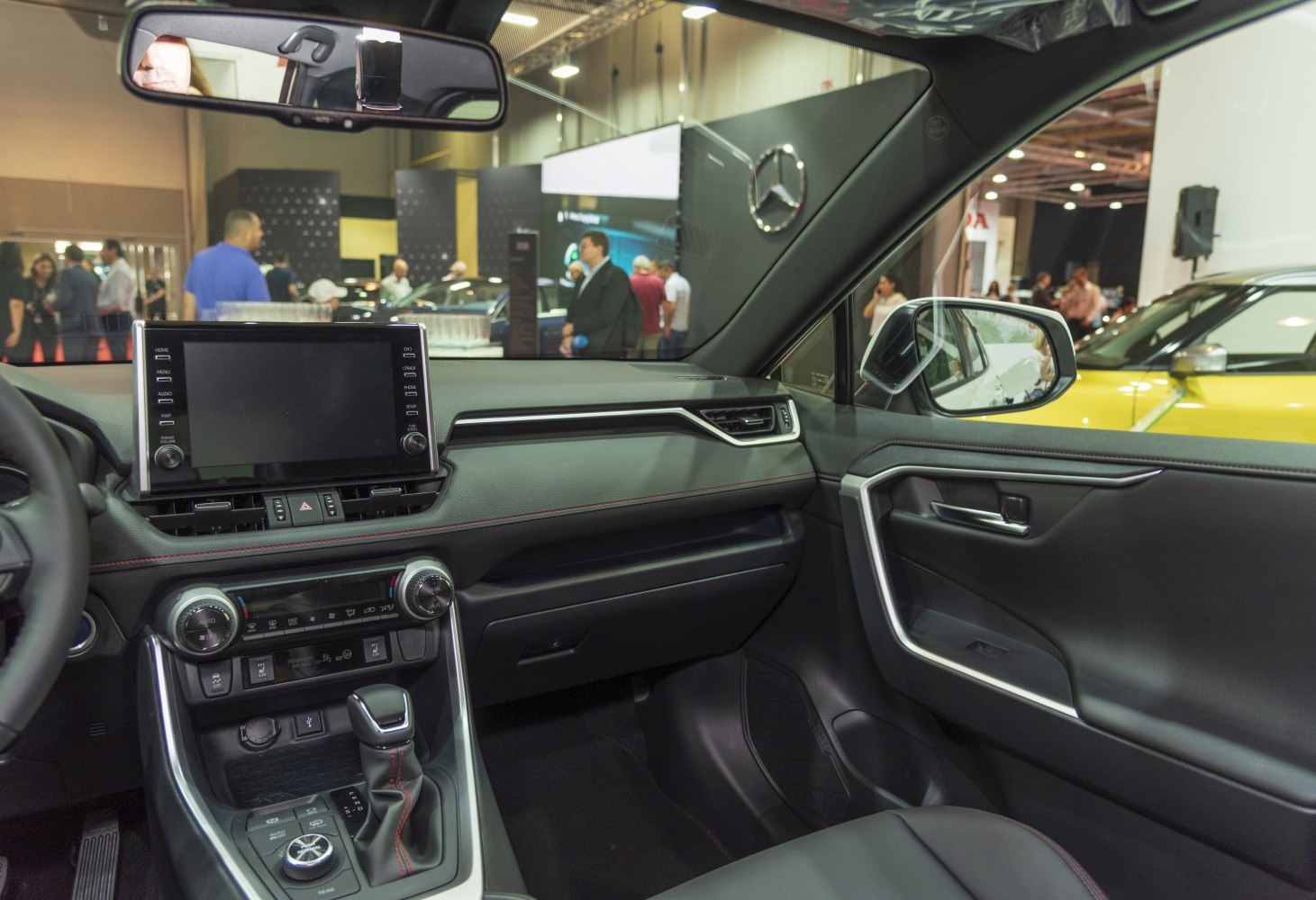 Modern car interior with touchscreen infotainment and climate control panel