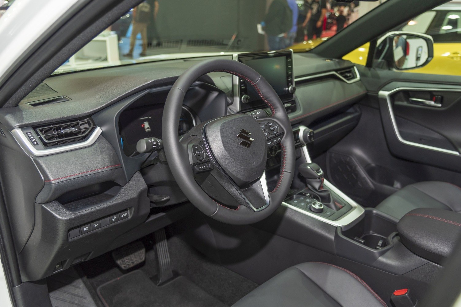 Modern car interior with dashboard and multifunction steering wheel
