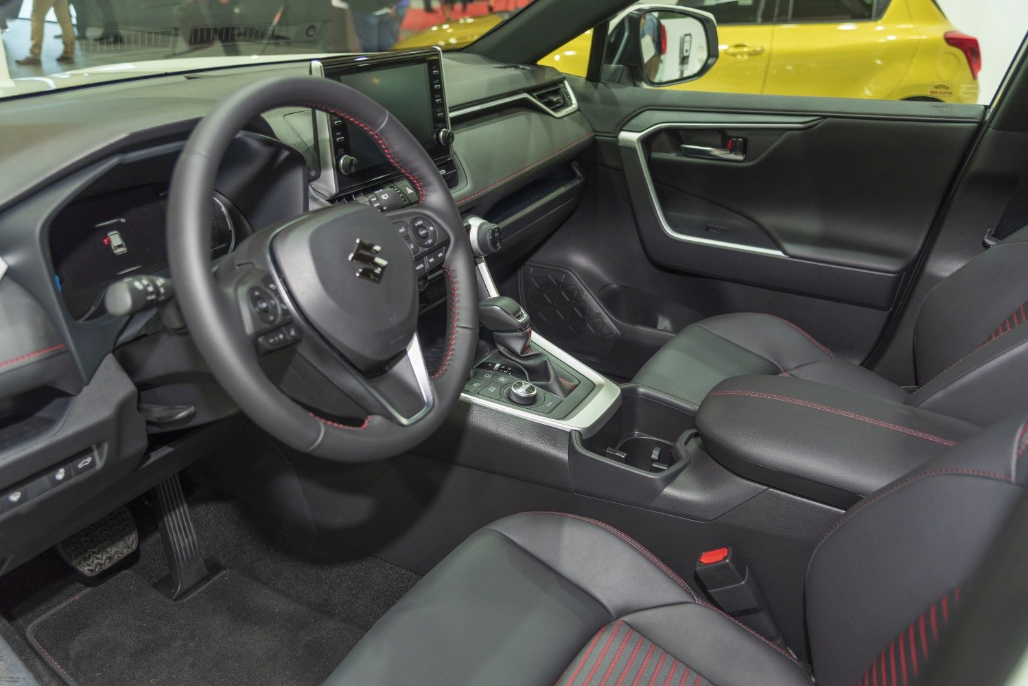 Interior dashboard and leather-trimmed steering wheel with red stitching