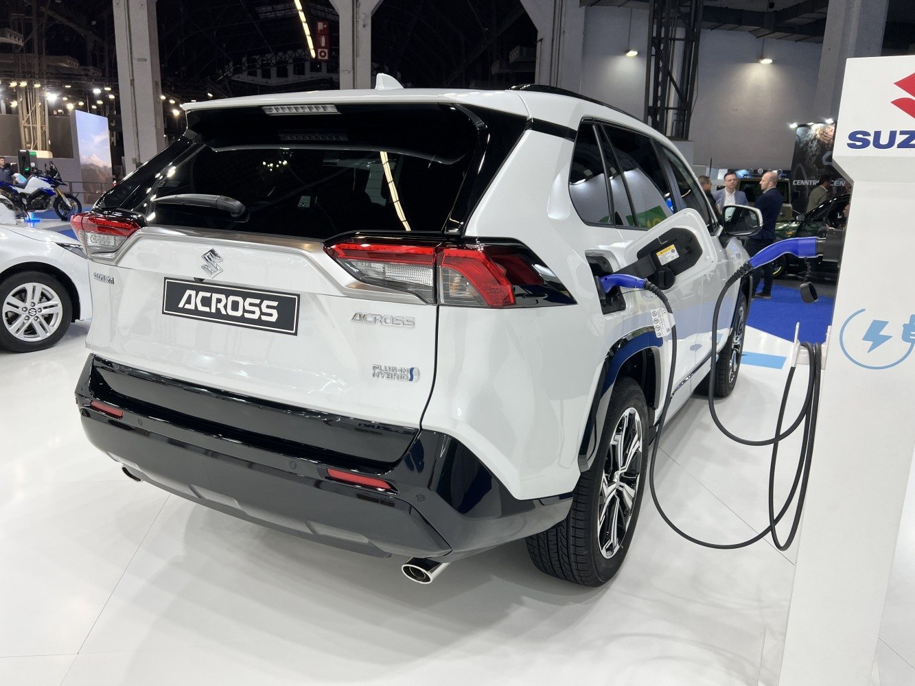 Rear view of plug-in hybrid with charging port and cable