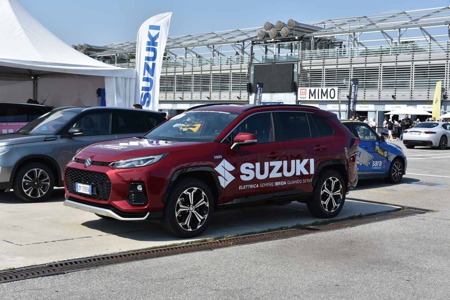 Front and side profile of hybrid SUV with distinctive grille and alloy wheels