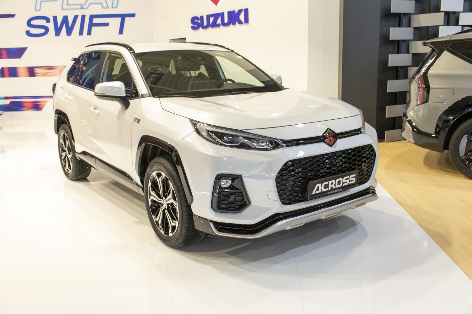 Front and side view with LED headlights and bold grille