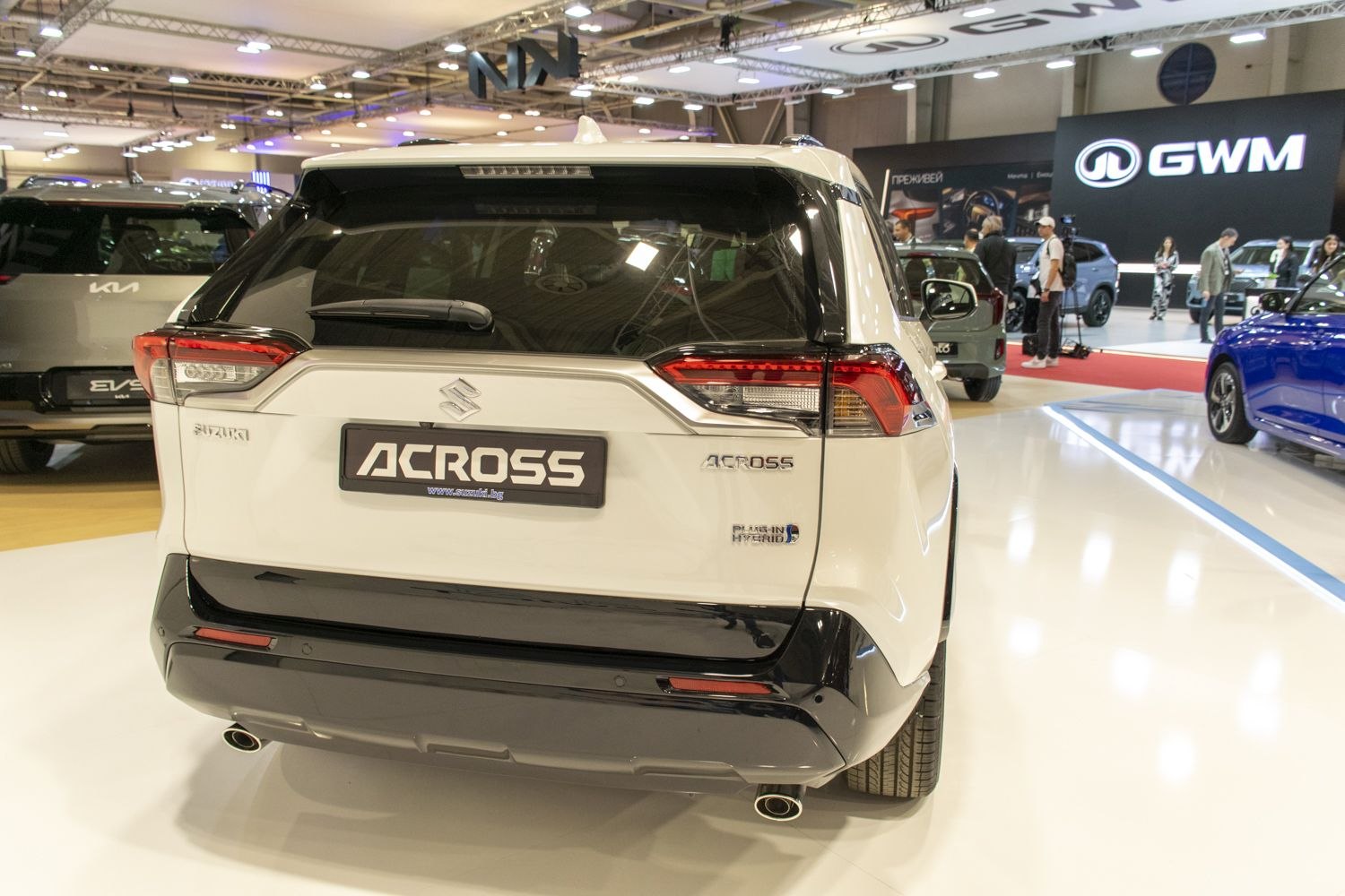 Rear view of a plug-in hybrid SUV with distinctive taillights and dual exhaust pipes
