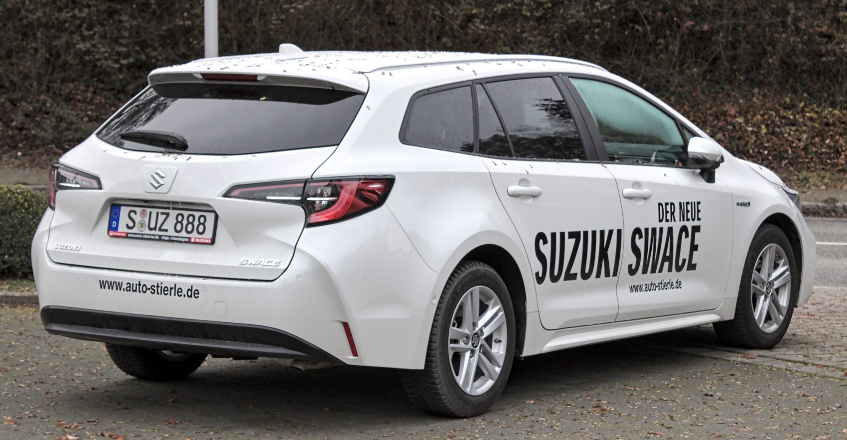 Rear and side view of a hybrid station wagon with distinctive lights and alloy wheels