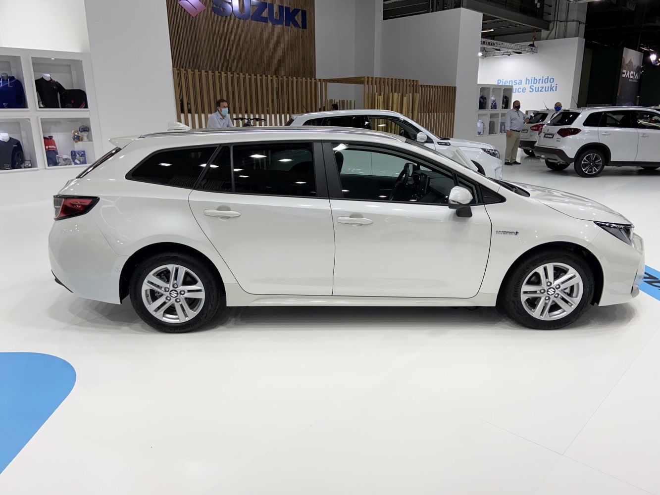 White hybrid wagon with sleek side profile and alloy wheels