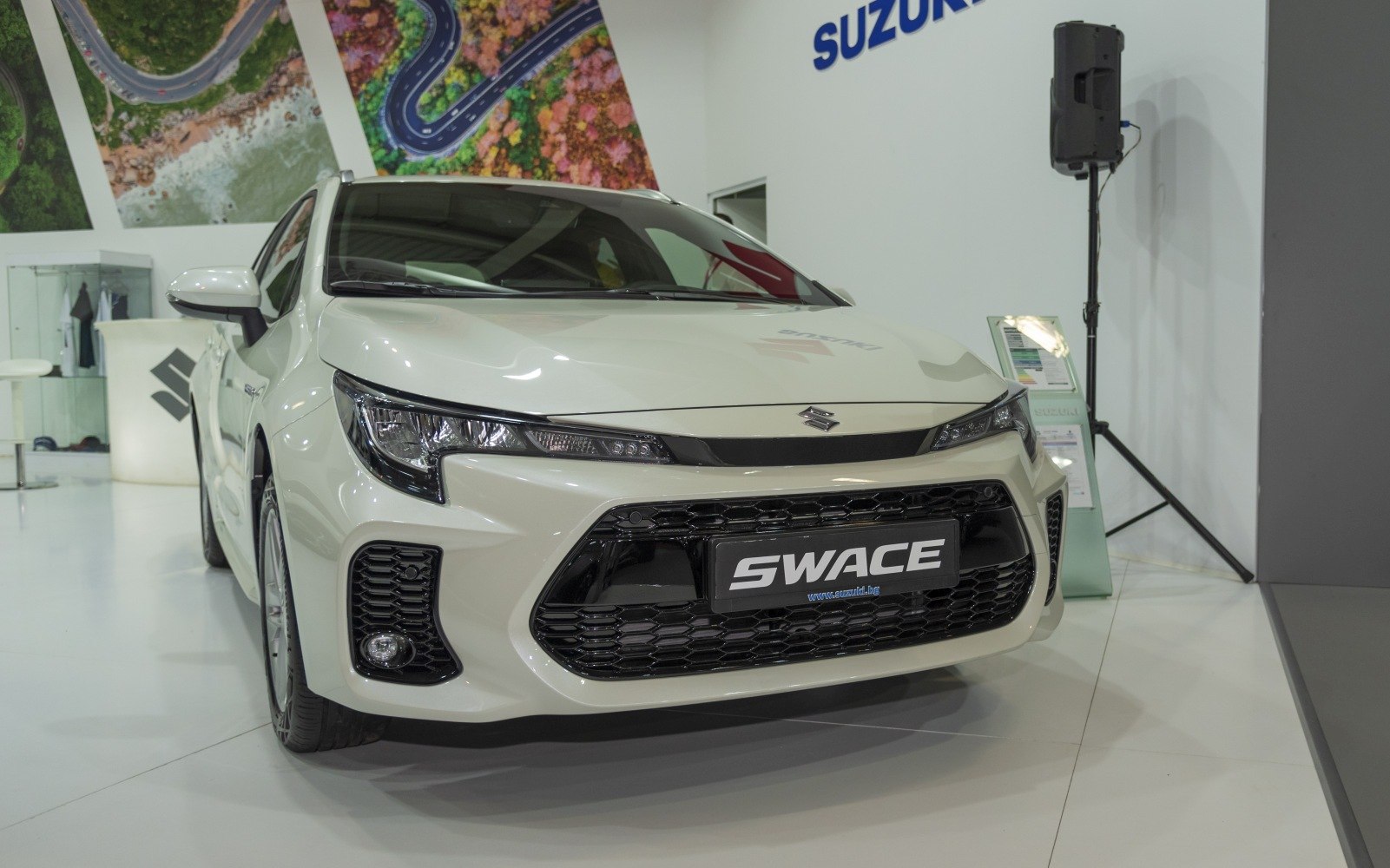 Modern LED headlights and prominent black mesh grille front view