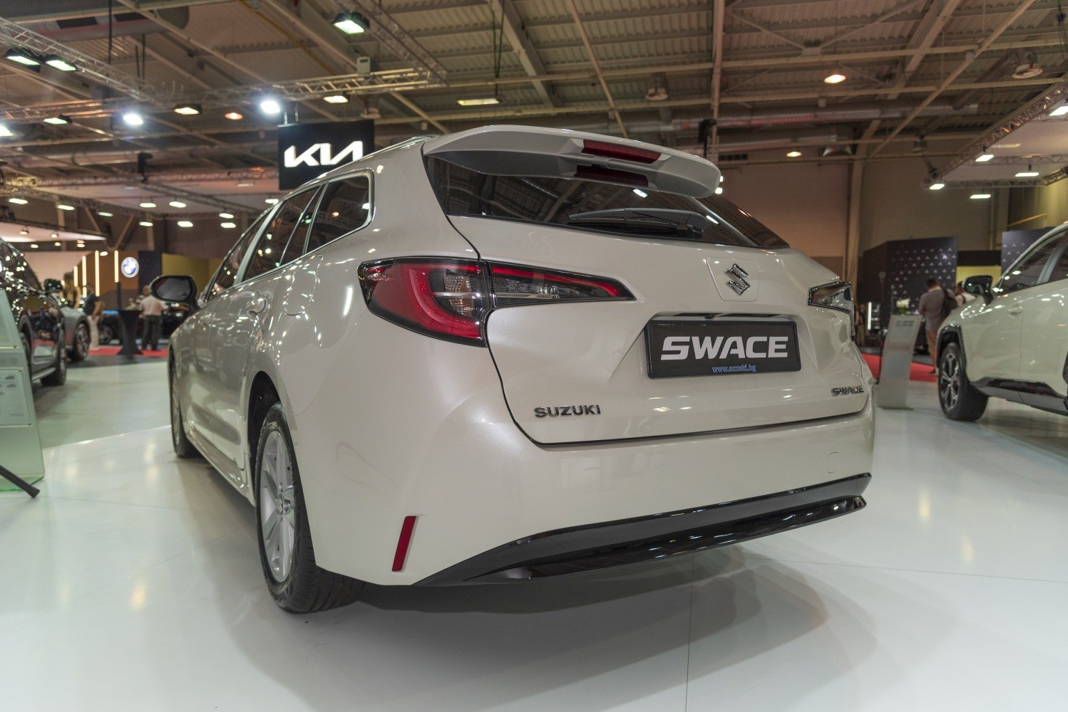 Rear view of a modern hatchback with sharp taillights and rear spoiler