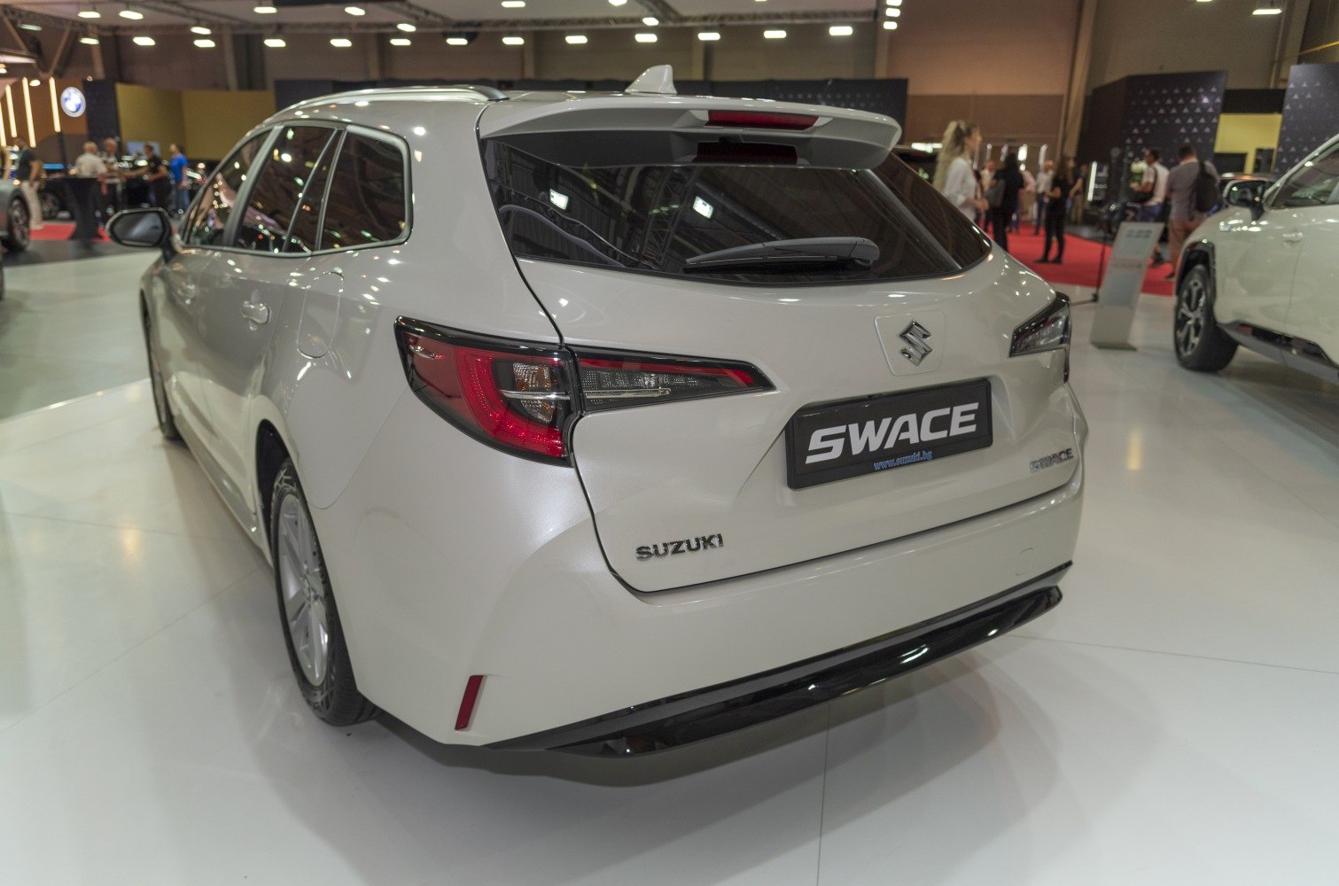 Rear view of a hatchback with modern taillight design and rear wiper