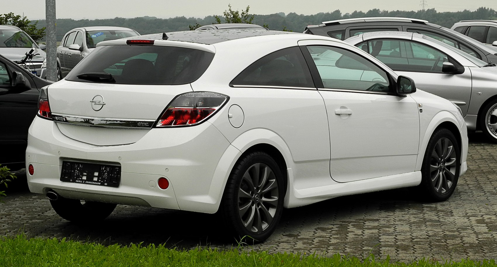 Rear side profile with alloy wheels and tinted windows