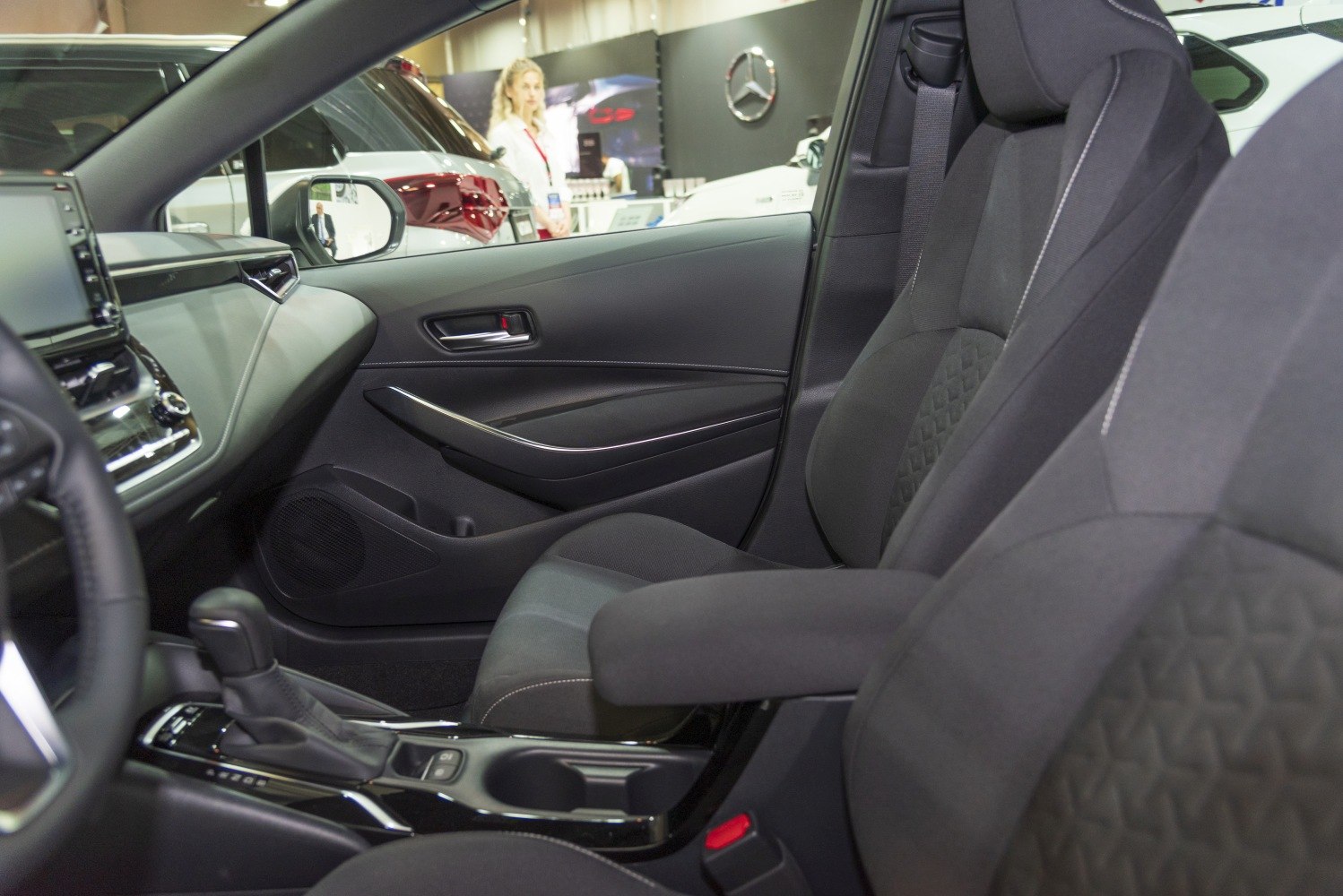 Front passenger seat and dashboard with gear shift and door panel