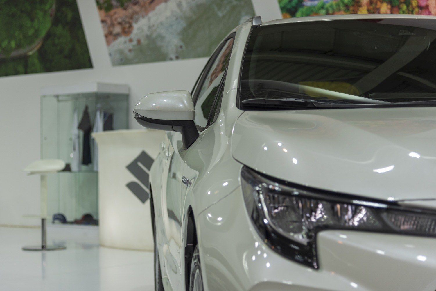 Close-up of front headlight and side mirror