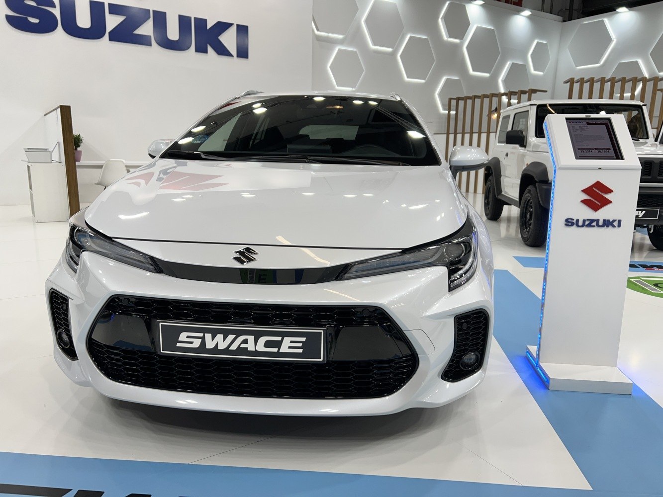 Front view featuring sleek headlights and prominent black grille.