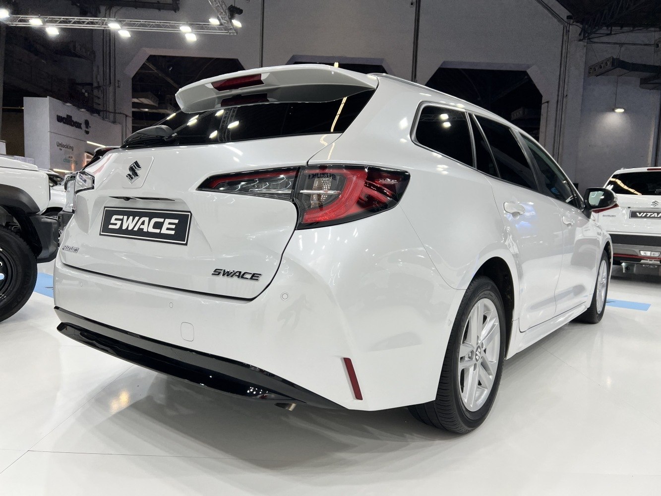 Rear and side view of hatchback with modern taillights and spoiler
