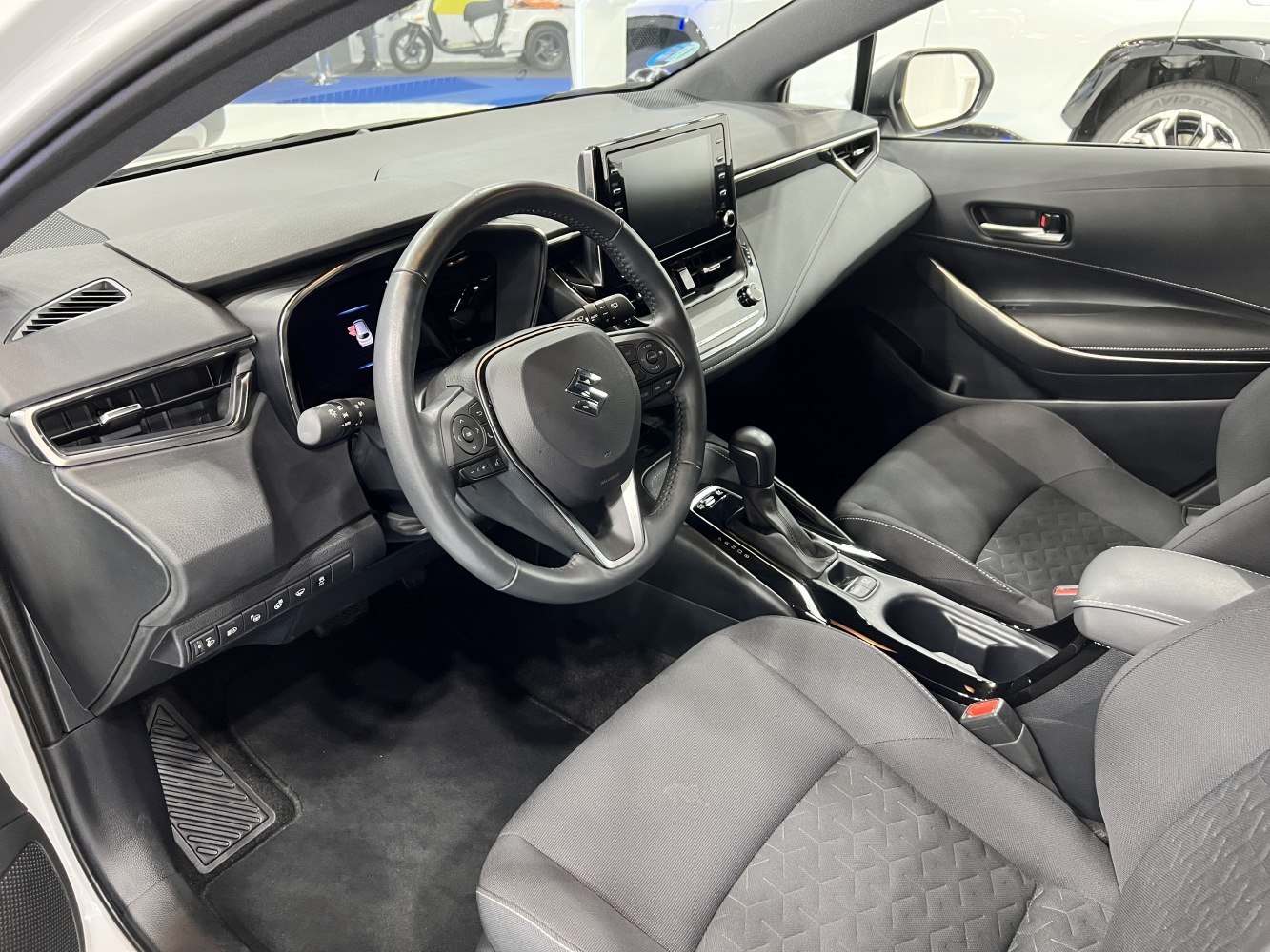Modern car interior with digital cluster and touchscreen infotainment