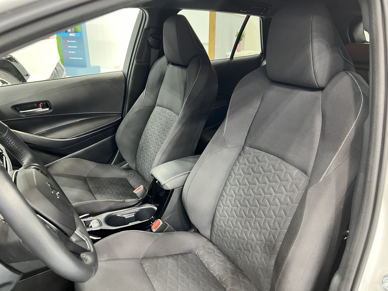 Front seats with patterned fabric upholstery and ergonomic design
