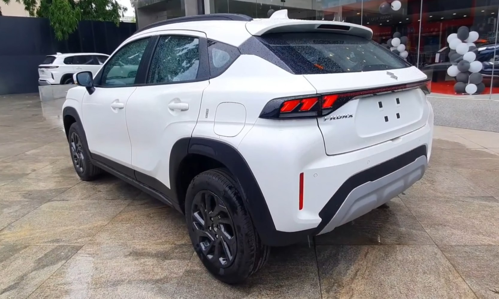 Rear side view with LED tail lights and black wheel arches