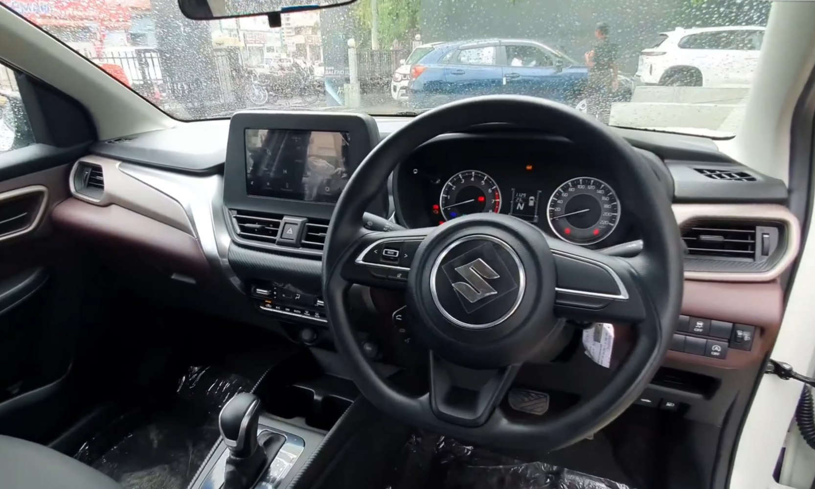 Modern car interior with dashboard and steering wheel.