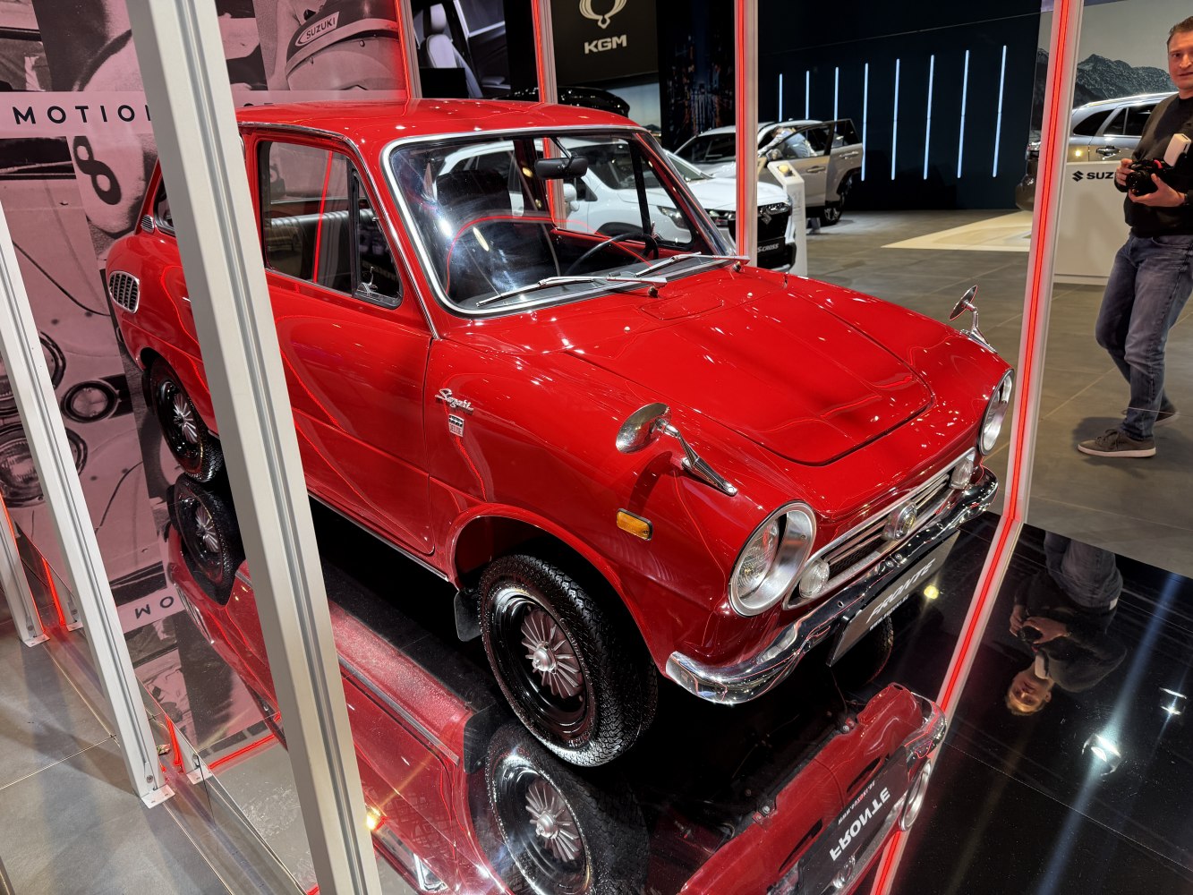 Compact small sedan with round headlights and chrome bumper.