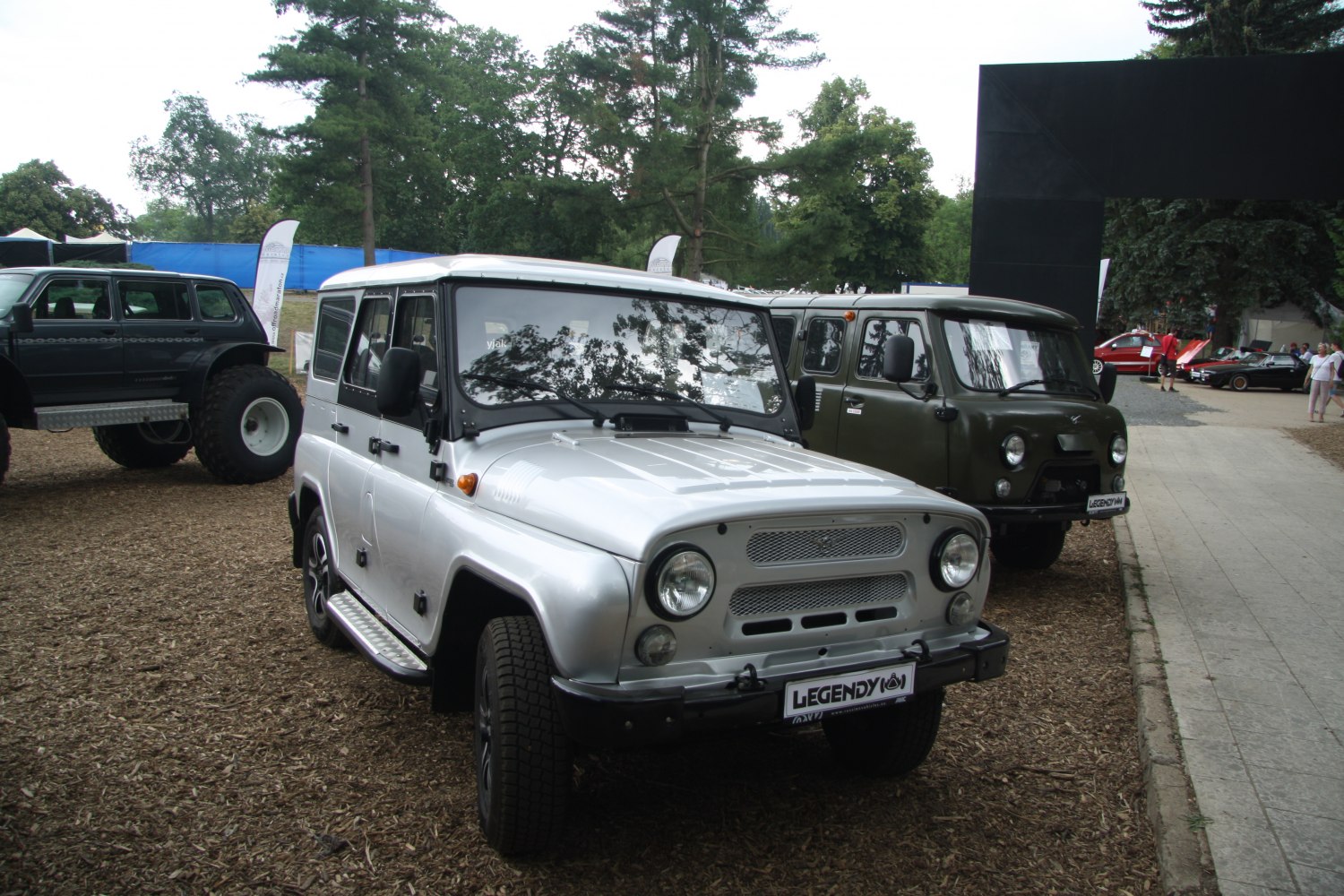 Front exterior of off-road vehicle with round headlights and mesh grille