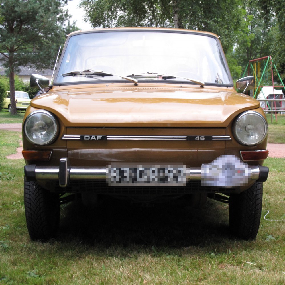 Front view with round headlights and chrome bumper