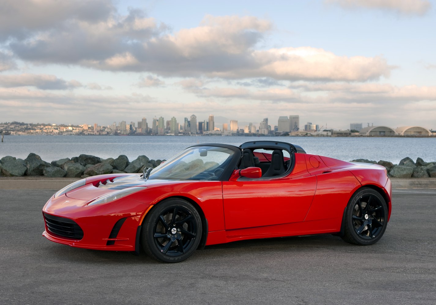 Electric sports convertible with aerodynamic vents and black alloy wheels