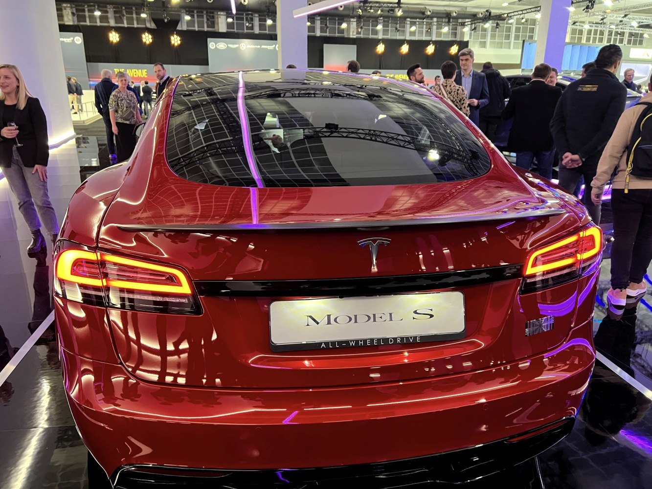 Rear view of sleek facelift 2021 electric sedan with LED taillights