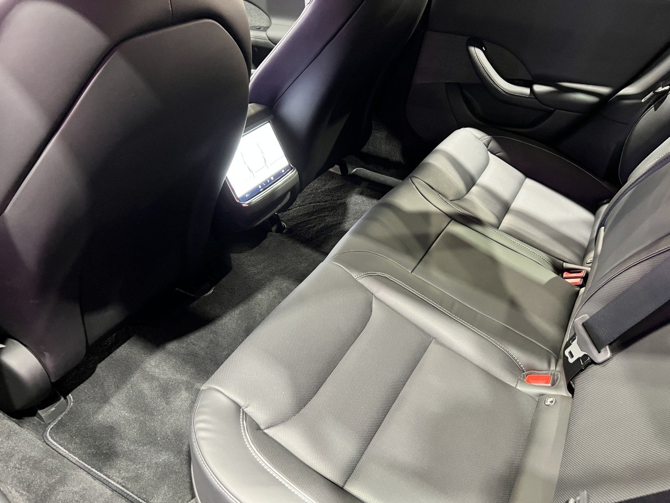 Rear leather seats with touchscreen control panel in rear center console