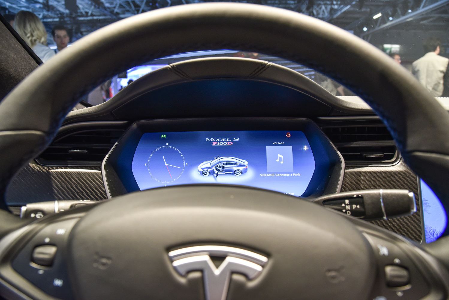 Digital instrument cluster and multifunction steering wheel with Tesla logo