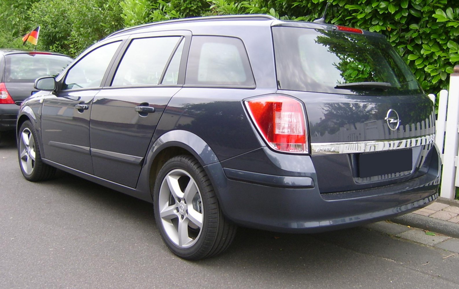 Rear and side of a facelifted station wagon with alloy wheels and tail lights