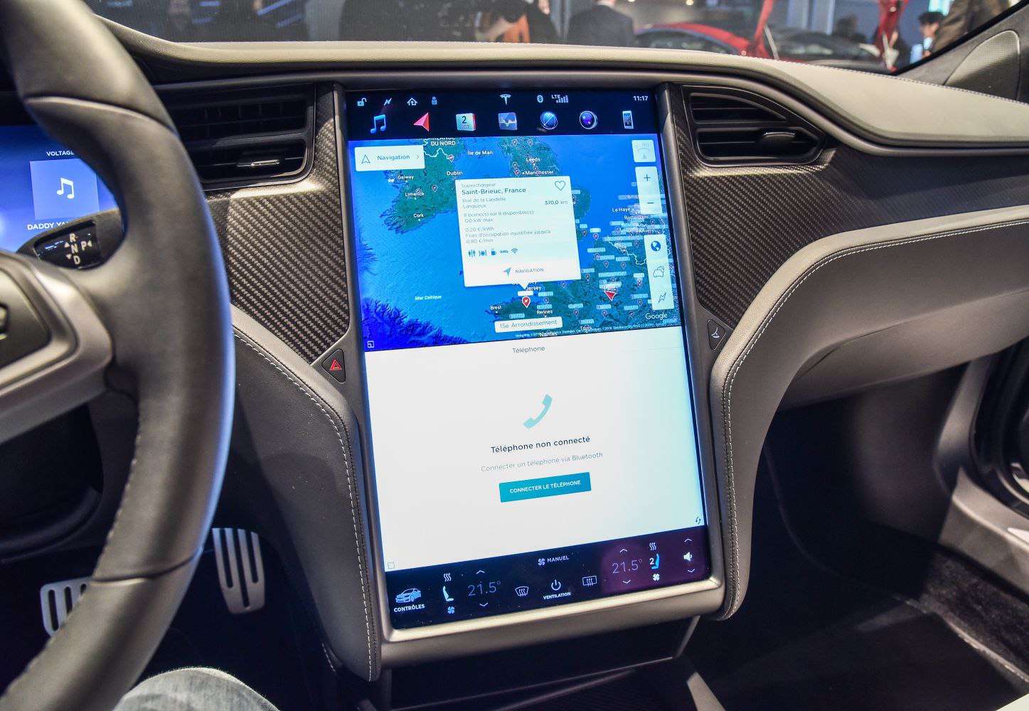 Large central touchscreen display with navigation and climate controls