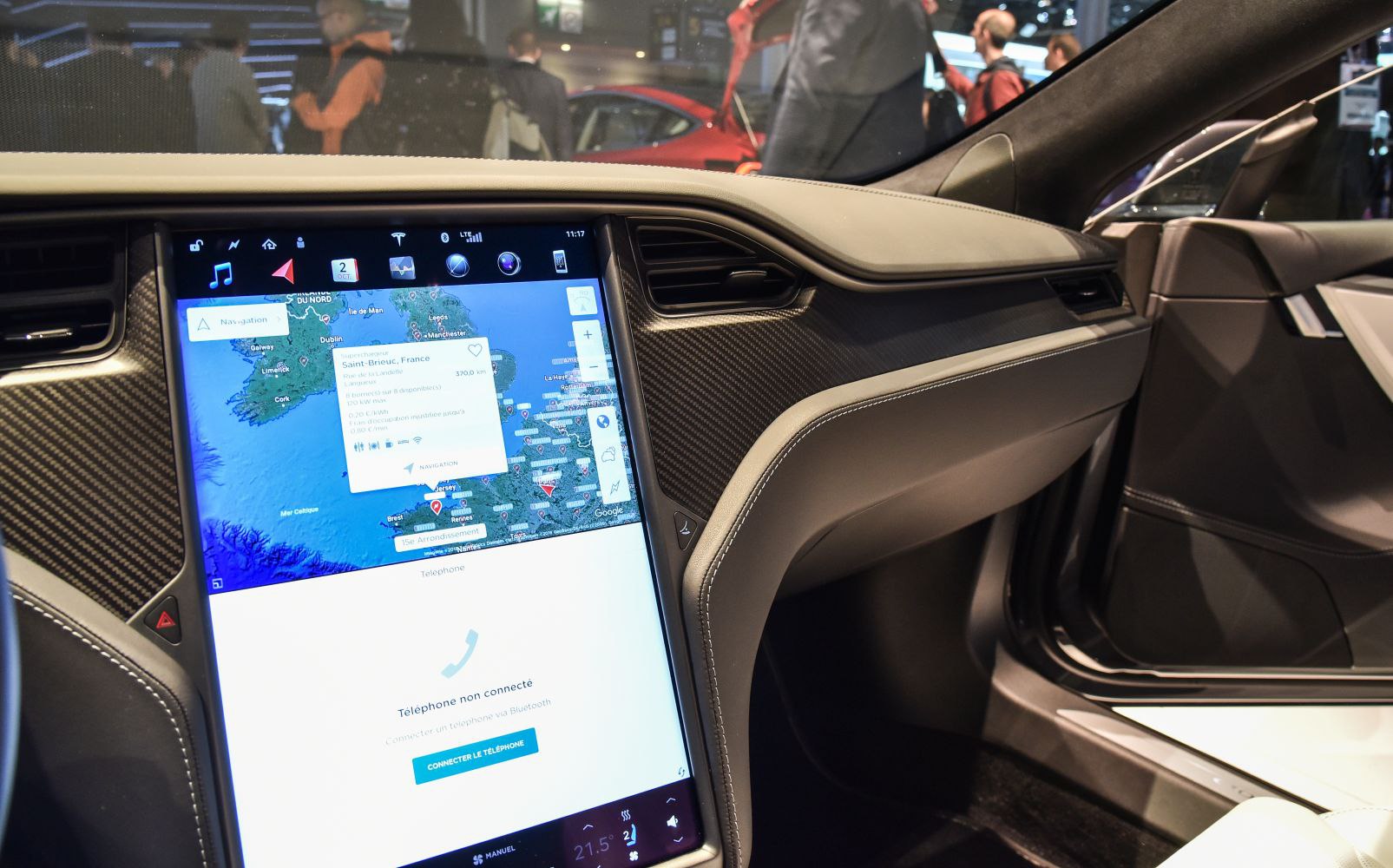 Large vertical touchscreen and carbon fiber dashboard trim
