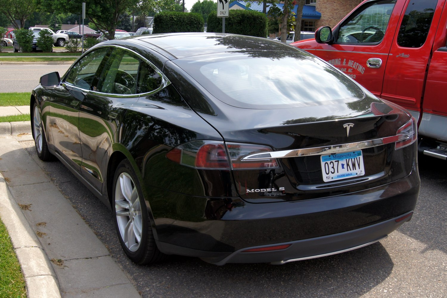 Smooth taillights and aerodynamic rear view of an electric sedan