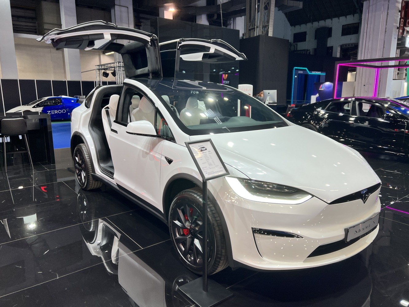 Electric SUV with falcon wing doors and sleek headlights