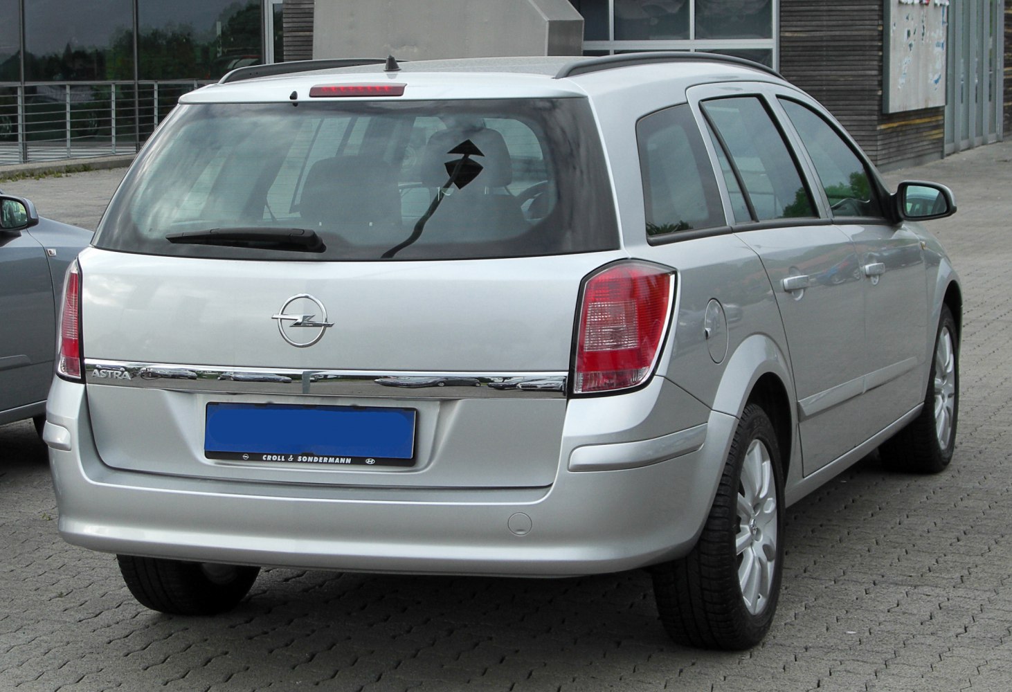 Rear view featuring chrome trim and distinct rear lights