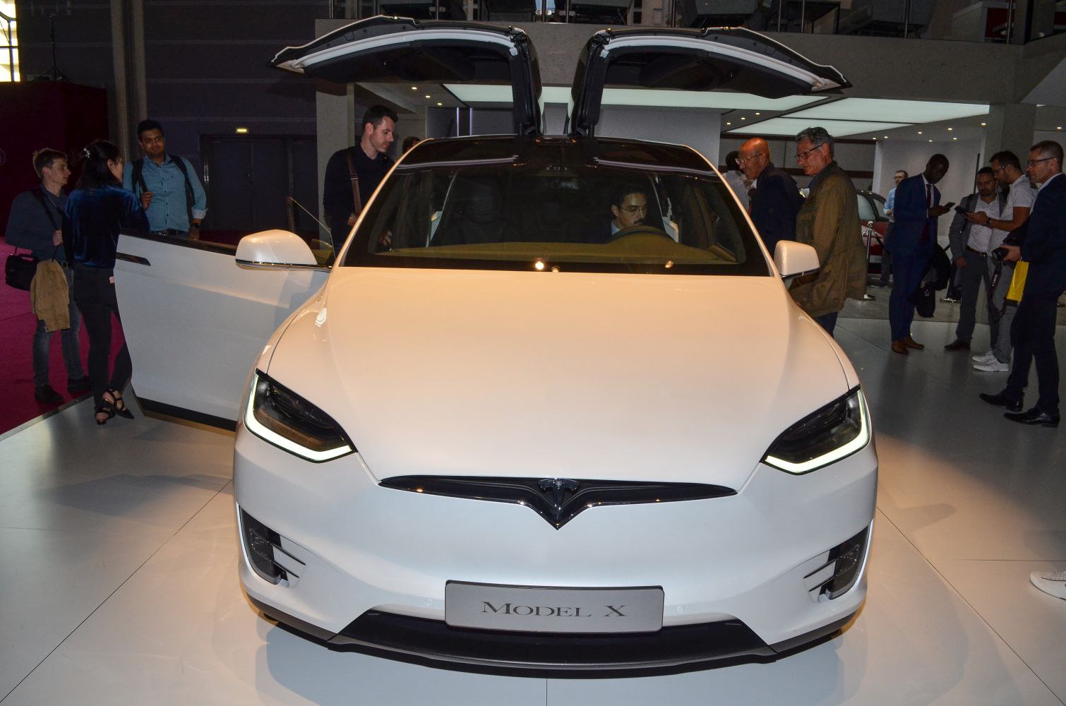 Front view with LED headlights and falcon wing doors open