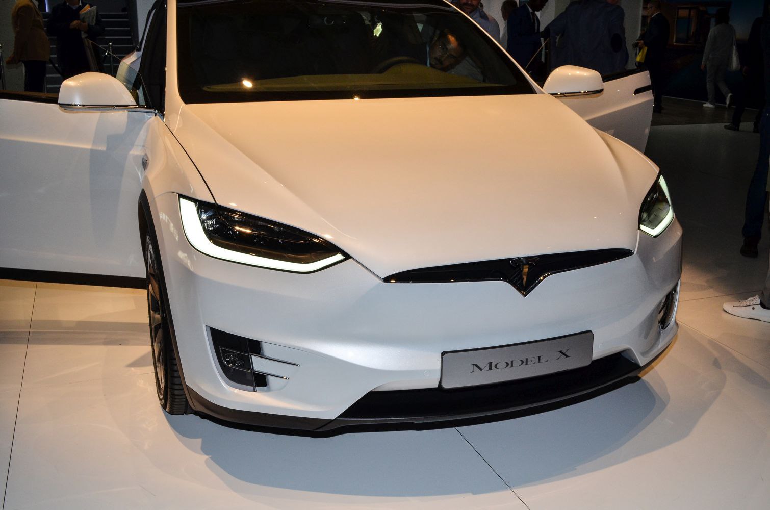 Front view of an electric SUV with LED headlights and aerodynamic styling