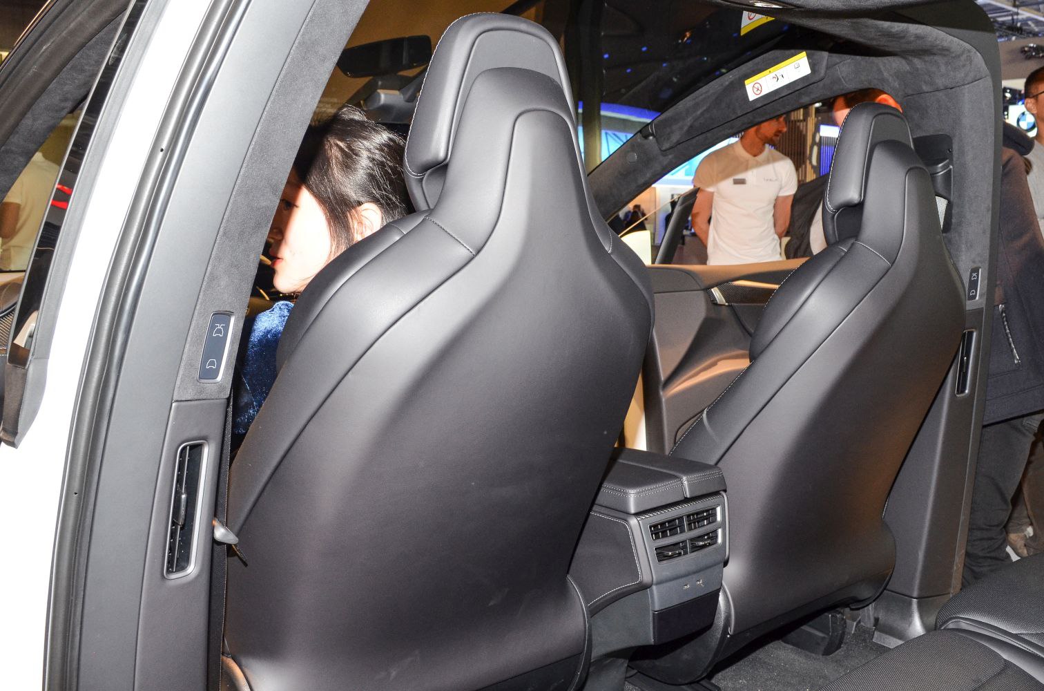 Rear-facing black eco-leather front seat backs with rear ventilation console