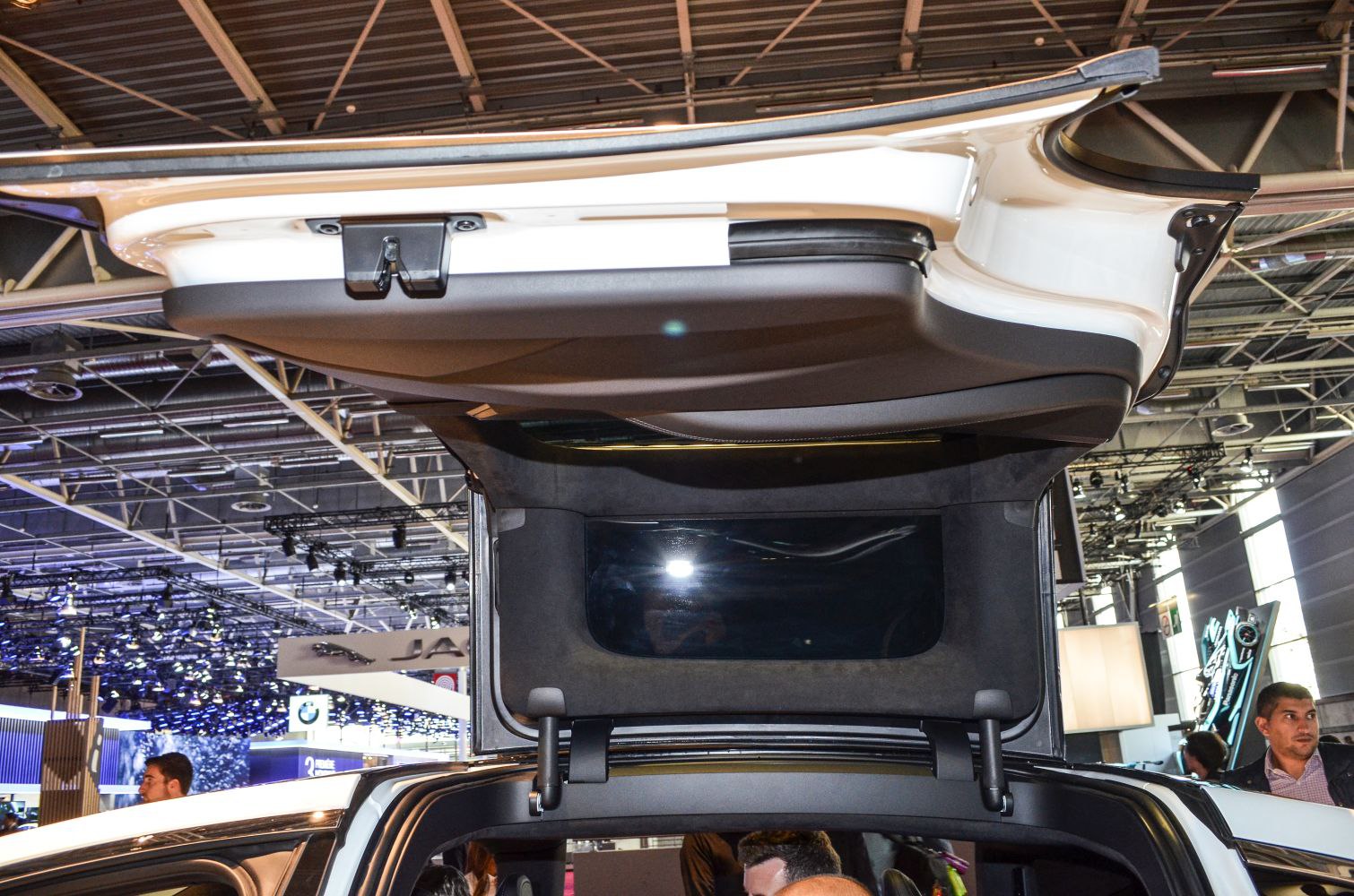 Close-up of falcon wing door hinge and mechanism on electric SUV