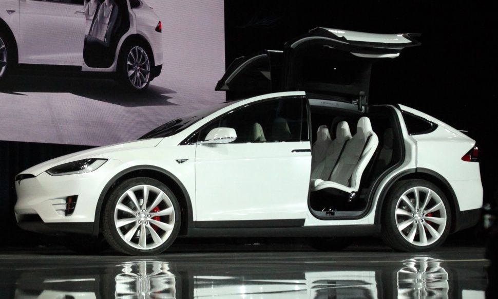 Falcon wing doors and sleek aerodynamic electric SUV design