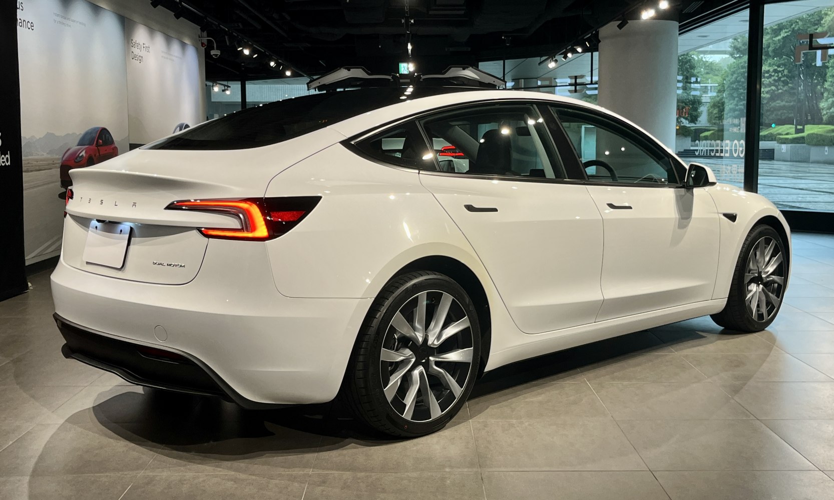 Rear view with updated taillights and side profile with alloy wheels