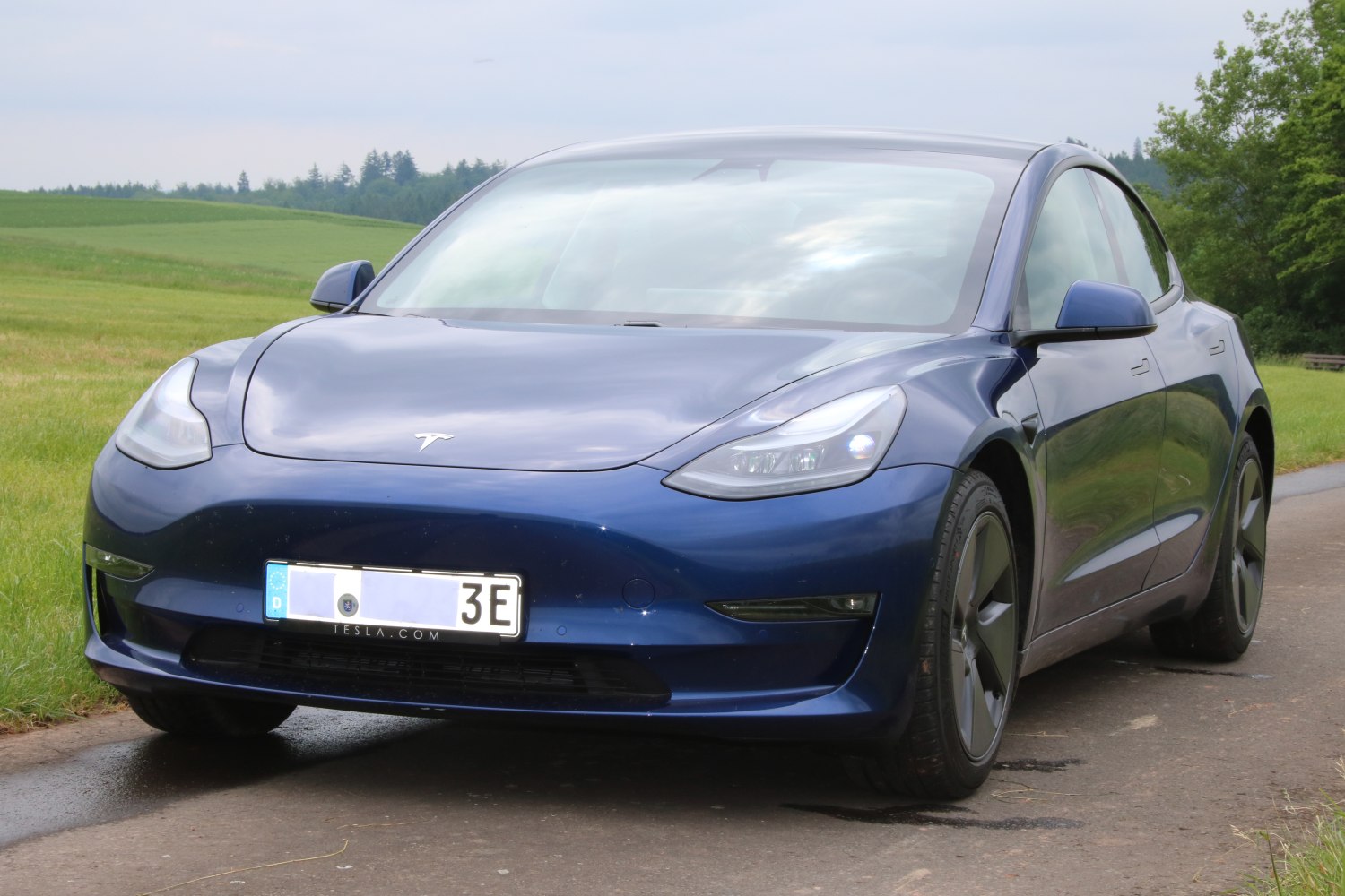 Front angled view with LED headlights and sleek aerodynamic design