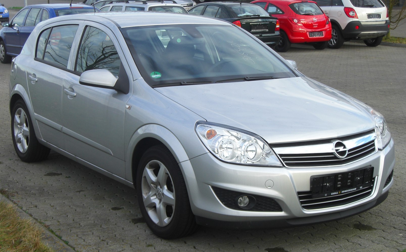 Silver hatchback with distinct headlight and alloy wheel design