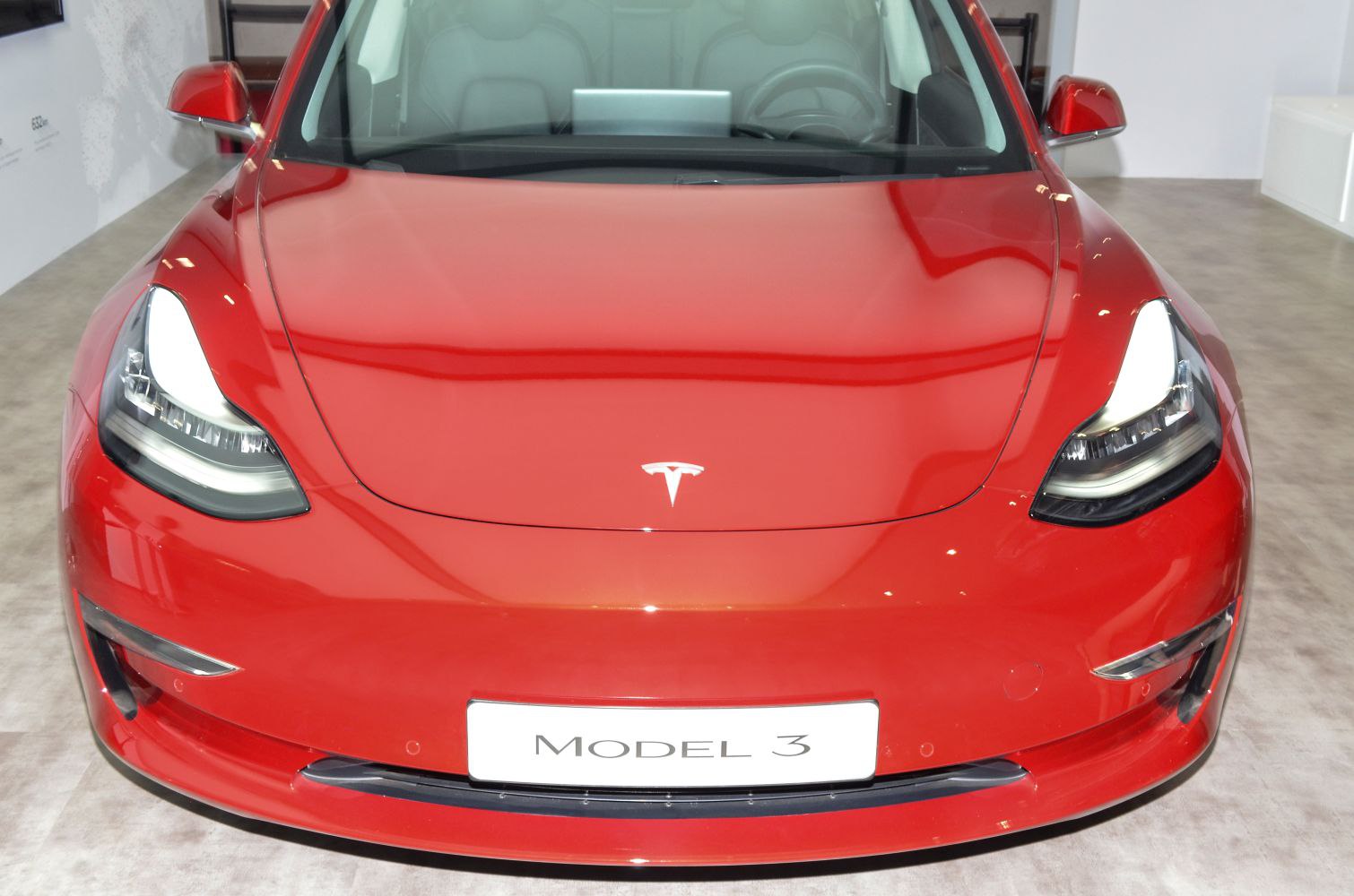Front view with LED headlights and smooth aerodynamic hood in red