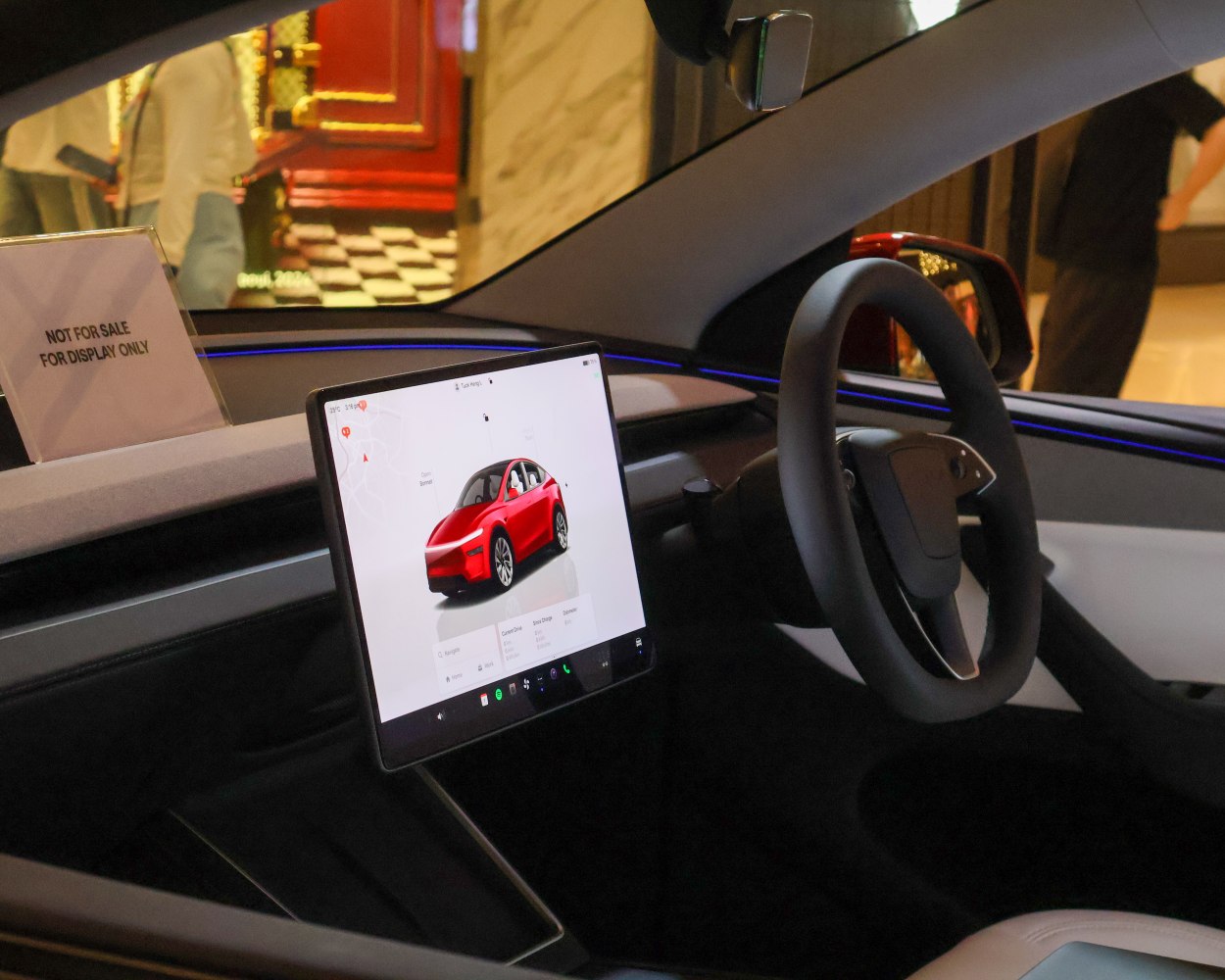 Large central touchscreen display and sleek steering wheel
