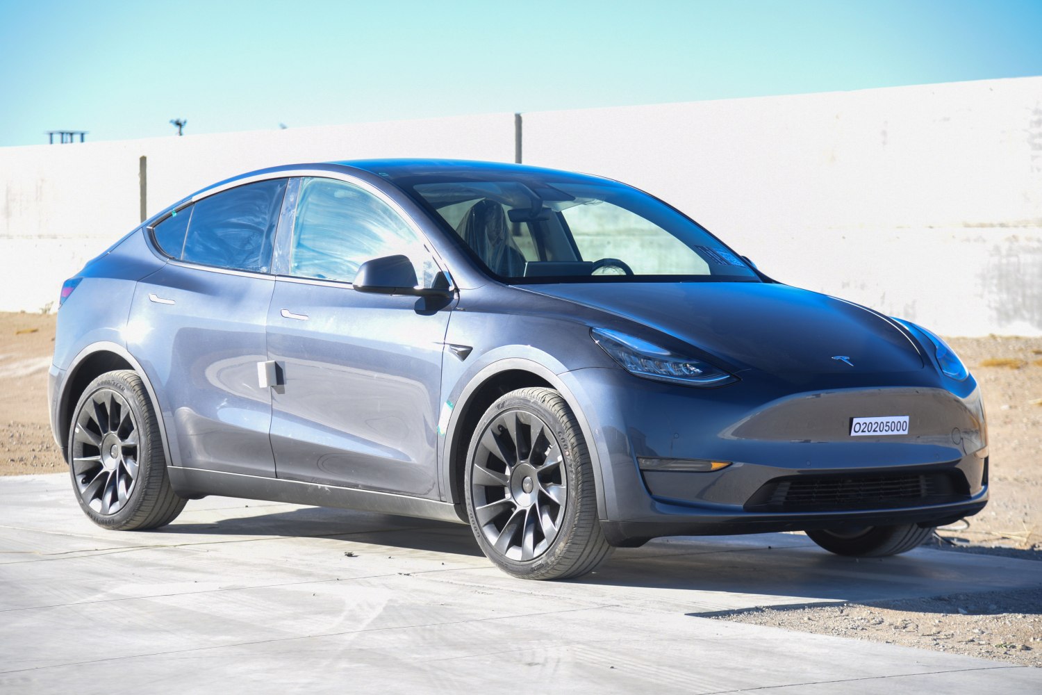 Front-side view of an electric SUV with aerodynamic design and black rims