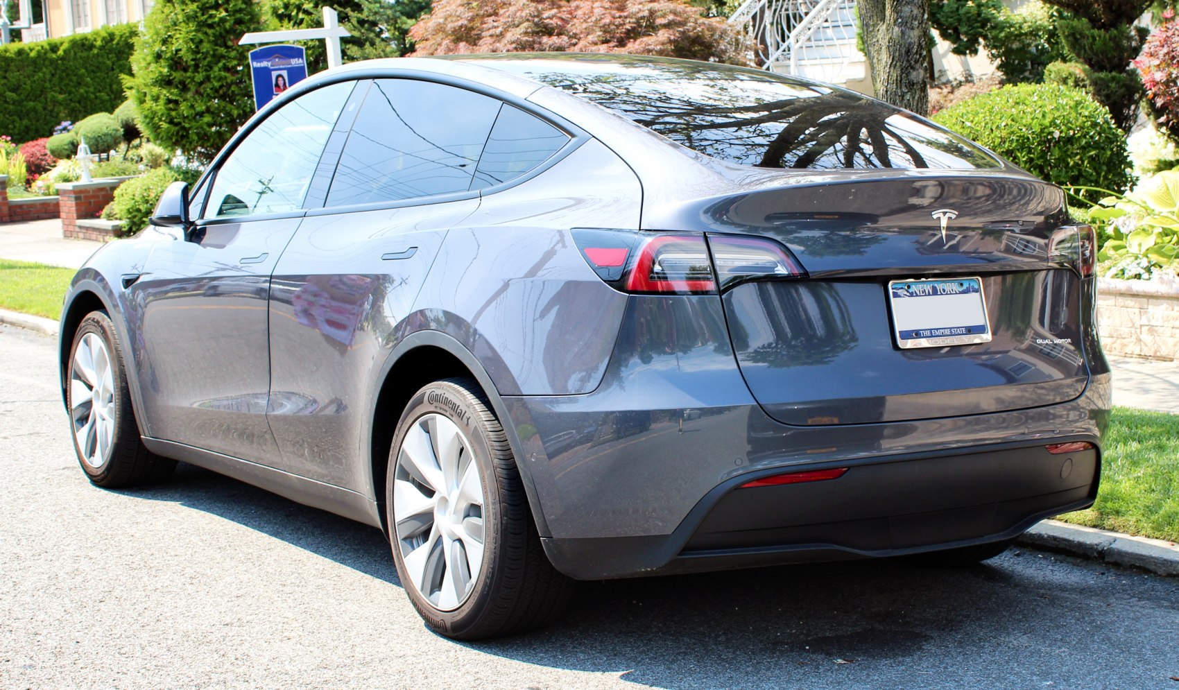 Rear and side view of a sleek modern electric SUV