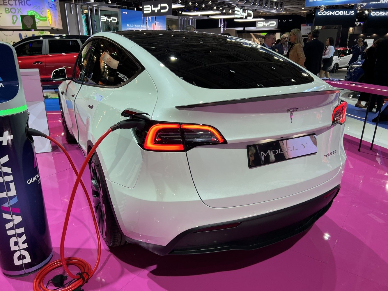 Electric SUV rear view with LED taillights and charging cable plugged in