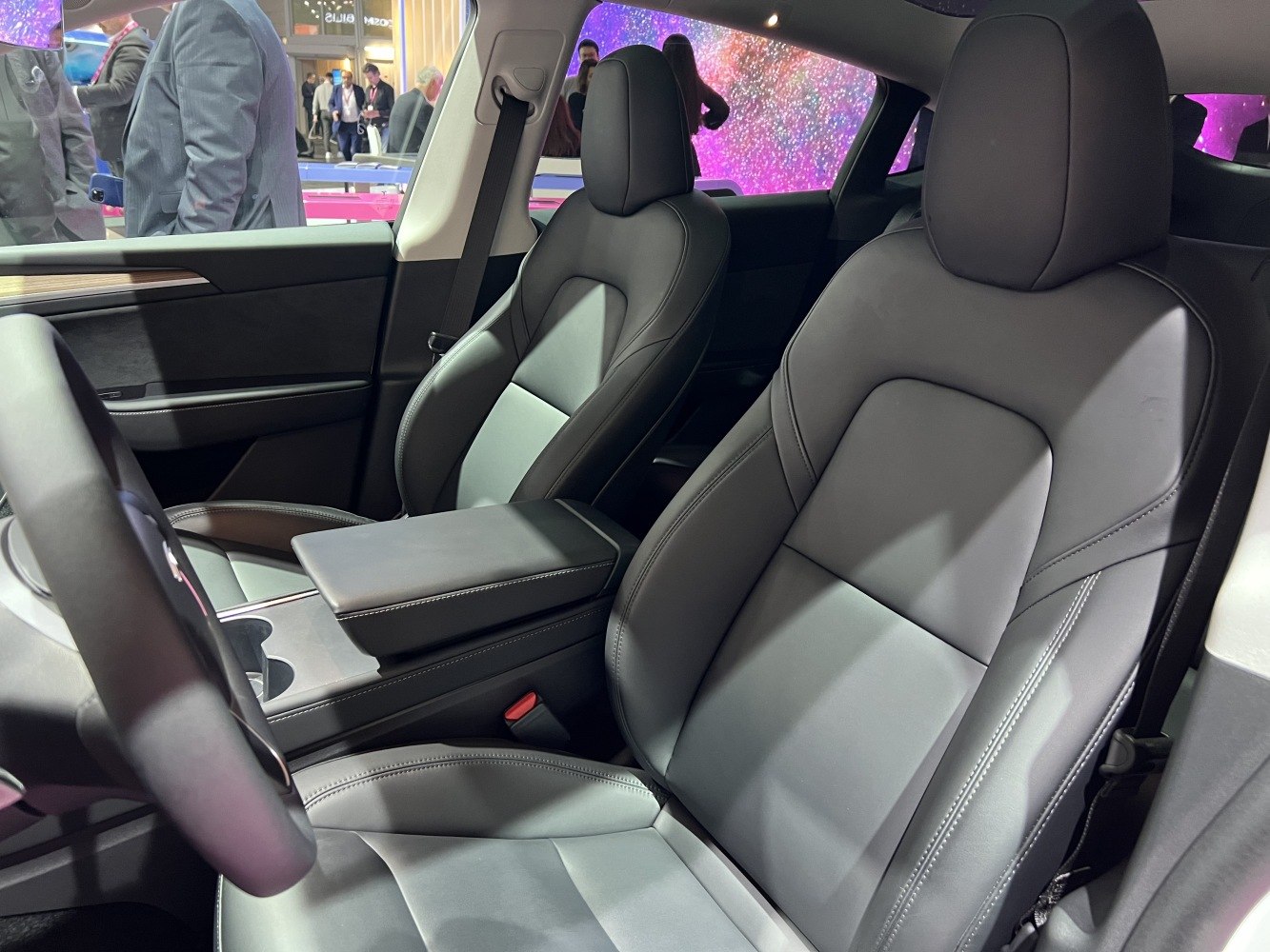 Premium front seats and central armrest console in a vehicle interior